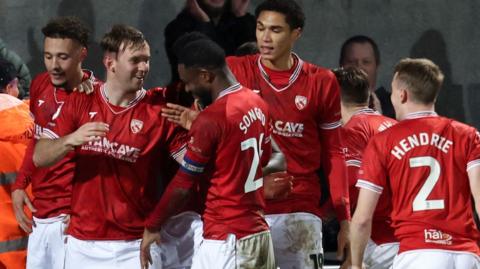 Morecambe celebrate scoring against Tranmere