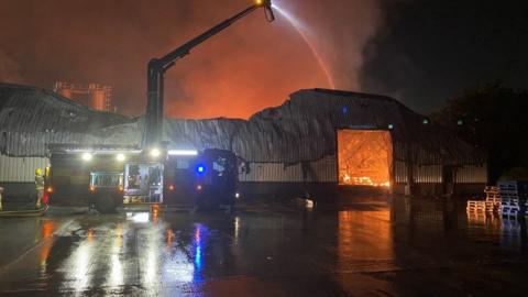 Firefighters deal with a fire at Blackburn's Shadsworth Business Park
