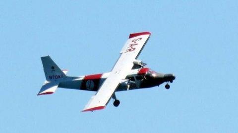 A picture of a red and white aircraft. It is the channel islands air search aircraft. 