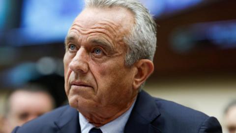 Robert F. Kennedy Jr, in suit and tie, raises his eyebrows sceptically during hearing with the House Judiciary Subcommittee on the Weaponization of the Federal Government on Capitol Hill on July 20, 2023 in Washington, DC. 