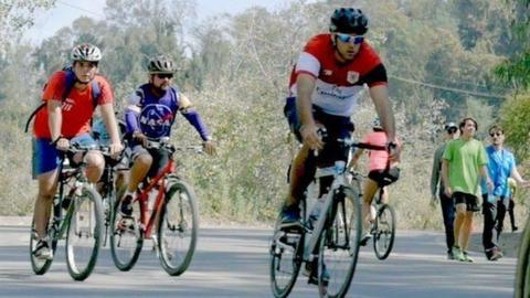 Cyclists riding on a road