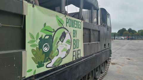 A tank with a sign on the side saying "powered by biofuel".