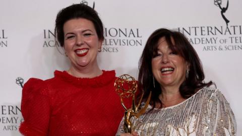 Derry Girls creator Lisa McGee and executive producer Liz Lewin pose with the Best Comedy award