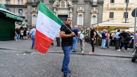 Five Star movement supporter holding Italian flag