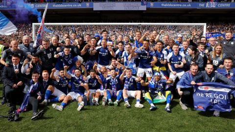 The Ipswich players and staff celebrate their promotion to the Premier League after the EFL Championship