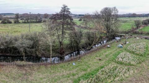 A general view of Parndon Lock Meadow, which is mostly large green fields with trees.