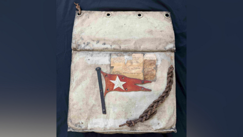 The Titanic lifeboat seat cushion, including a piece of rope.