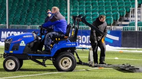 A tractor on the Scotstoun Stadium pitch