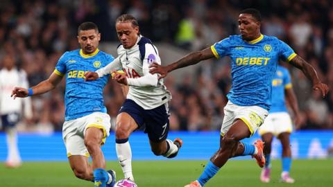 Andre, Xavi Simons and Jackson Tchatchoua competing for the ball