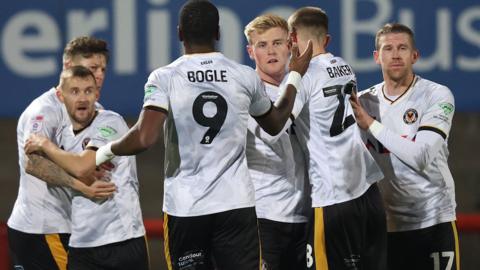 Will Evans celebrates his first-half equaliser with his Newport team-mates