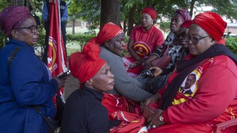 United Transformation Movement (UTM) supporters mourn at the start of a vigil at the party headquarters in Lilongwe June 11, 2024, to mourn their founder and president Saulos Klaus Chilima 