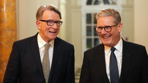 Peter Mandelson and Keir Starmer are pictured laughing wearing suits