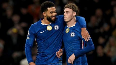 Reece James with his arm round Cole Palmer during a game