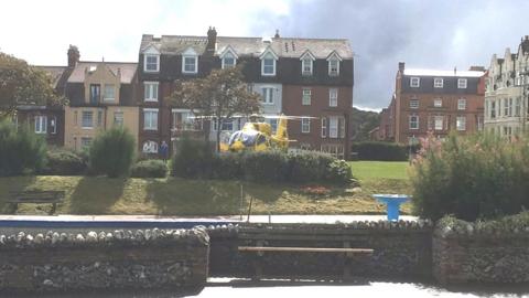 The air ambulance at Cromer after a paraglider crashed into The Wellington Hotel