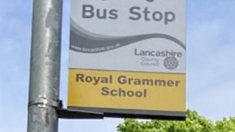 Bus stop sign which reads "Royal Grammer School"