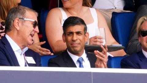 Prime Minister Rishi Sunak (bottom centre) watches from the box during day four of the second Ashes test match at Lord's, London.