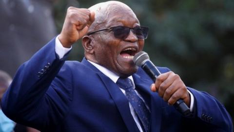 South Africa's former President Jacob Zuma sings to supporters after appearing at the High Court in Pietermaritzburg, South Africa, May 17, 2021.