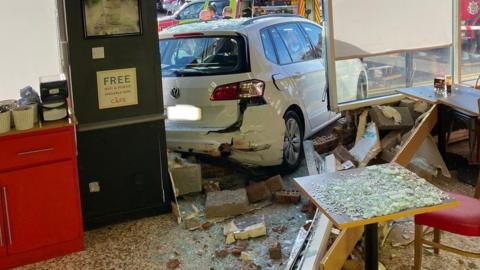 Car in supermarket cafe