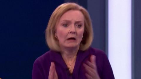 Liz Truss reacts