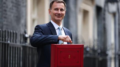 Jeremy Hunt holding the Red Box outside of 11 Downing Street on Budget Day in March ahead of the Budget