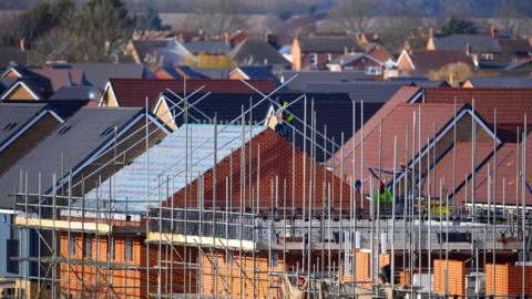 A generic picture of houses being built