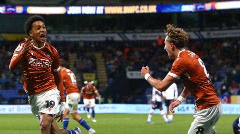 Andre Garcia celebrates his equaliser for Reading at Bolton