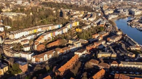 The Bristol city skyline. The Avon river is to the right of the image, with the tops of houses seen for miles.