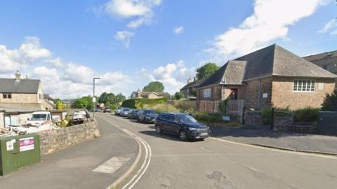 A street view of Over Lane in Baslow from the junction of School Lane.