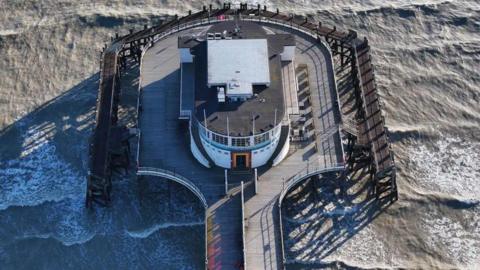 An aerial shot of the end of Worthing Pier.