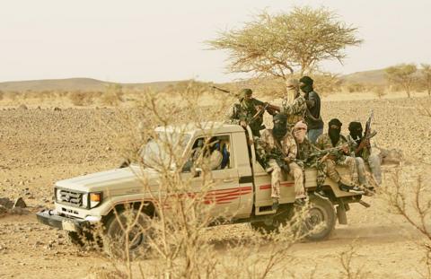 Armed, masked men in a pick-up truck in northern Mali