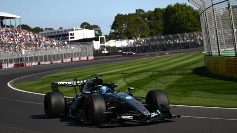 A close-up view of George Russell driving the Mercedes with a grandstand in the background during final practice for the Australian Grand Prix