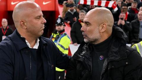 Close-up of Arne Slot (left) and Pep Guardiola