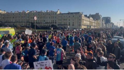 Hundreds of runners setting off in the Brighton Half Marathon.