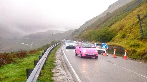 Cars make their way through traffic lights as the A83 reopened on Monda morning