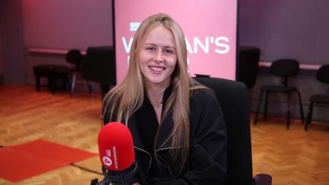 Hannah Hampton sat in the Woman's Hour studio in front of a red microphone and smiling