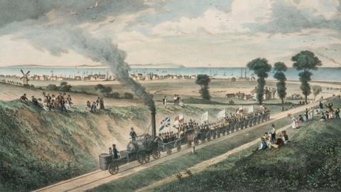 A colour drawing of a 19th Century steam railway with flags and people waving with the sea in the backgorund