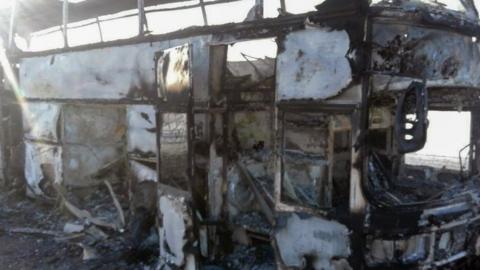 Kazakh government photo shows charred bus near Aktobe