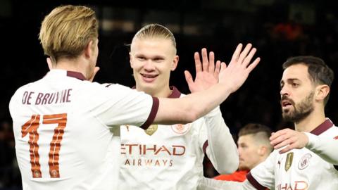 Manchester City's Erling Haaland celebrates scoring their first goal v Luton with Kevin De Bruyne and Bernardo Silva