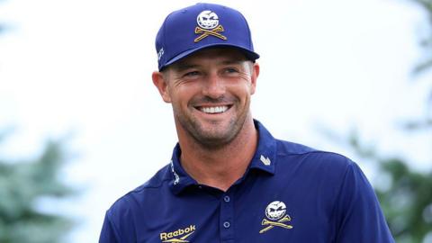 Bryson DeChambeau smiles while competing at the LIV Golf Indianapolis event