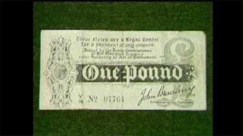 A £1 note on a green background.