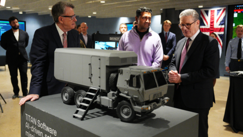 Former UK ambassador to the United States Lord Mandelson and Prime Minister Keir Starmer (R) tour Palantir Technologies headquarters with company employees and British military personnel on 27 February 2025 in Washington, DC.