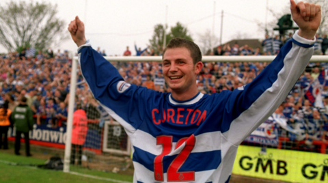 Jamie Cureton celebrates Reading's promotion to the First Division in 2002