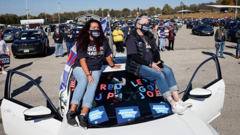 Biden supporters attend a drive-in rally in Iowa