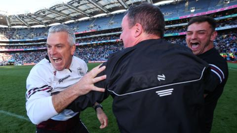 Padraic Joyce at full-time with his coaching staff