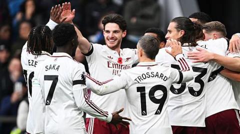 Arsenal players celebrate scoring against Burnley