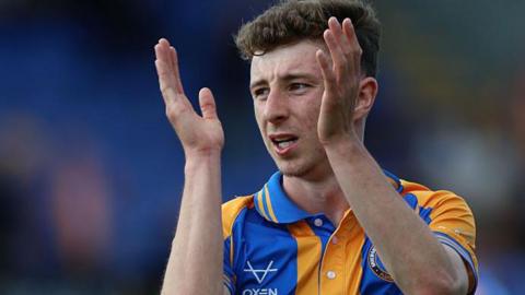 Shrewsbury striker Callum Stewart claps the crowd after a game