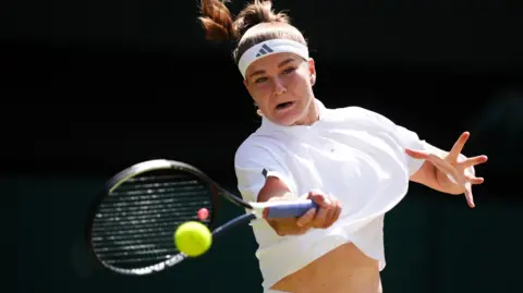 Karolina Muchova hits a forehand