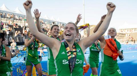 Katie Mullan and her Ireland team-mate celebrate after winning the silver medal at the 2018 World Cup in London