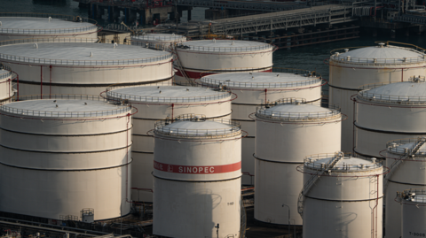 China Petroleum & Chemical Corp. (Sinopec) storage tanks at the container terminal in Hong Kong, China, on Tuesday, Nov. 14, 2023.