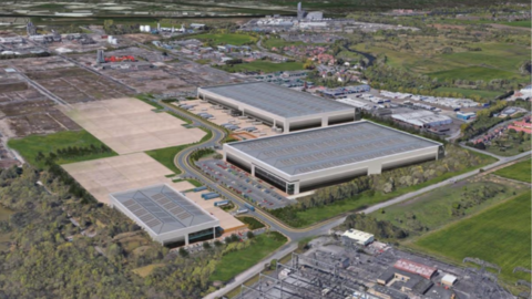 A computer generated aerial image of large warehouses surrounded by trees